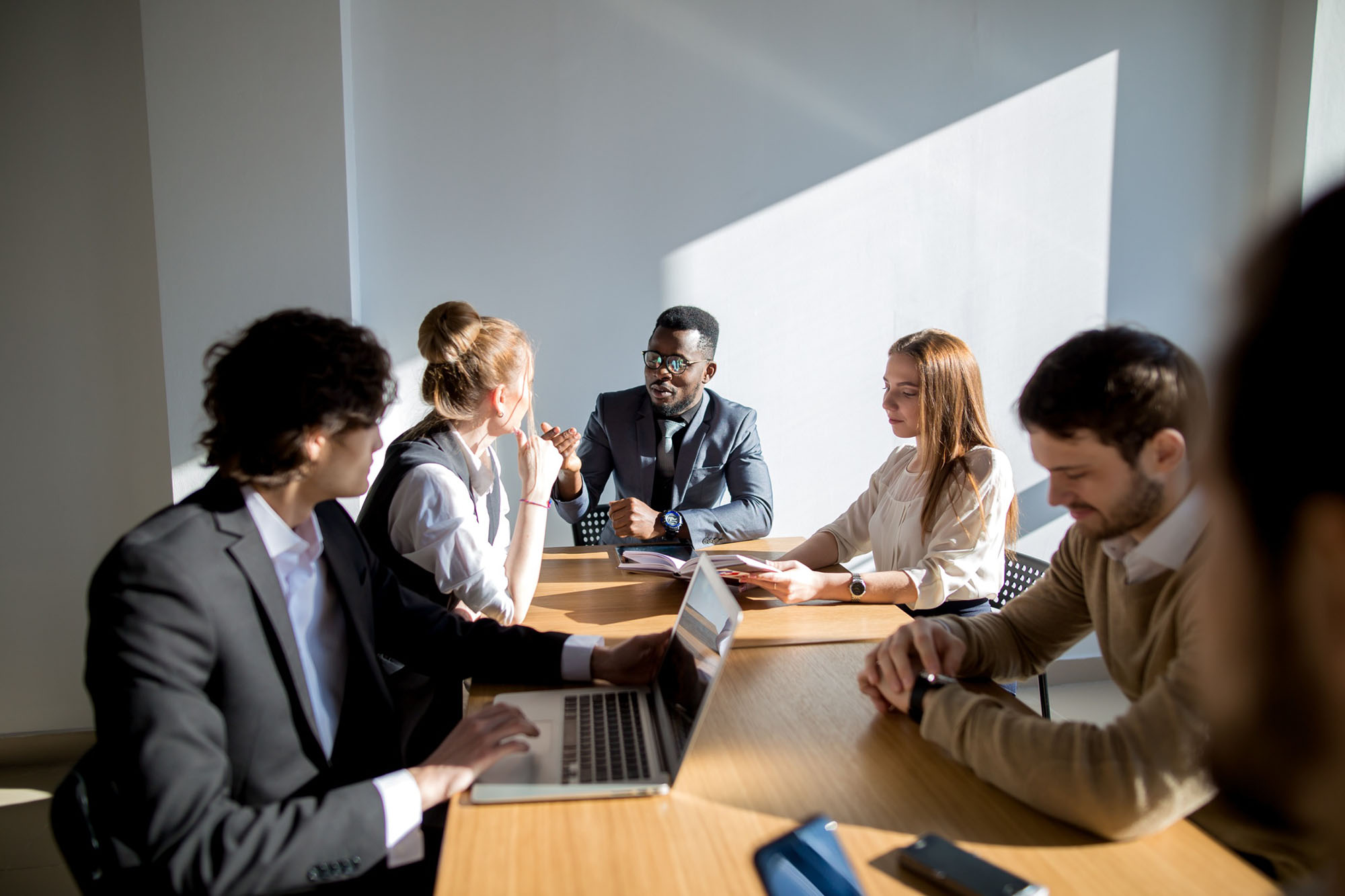 Business colleagues sitting around a table working together